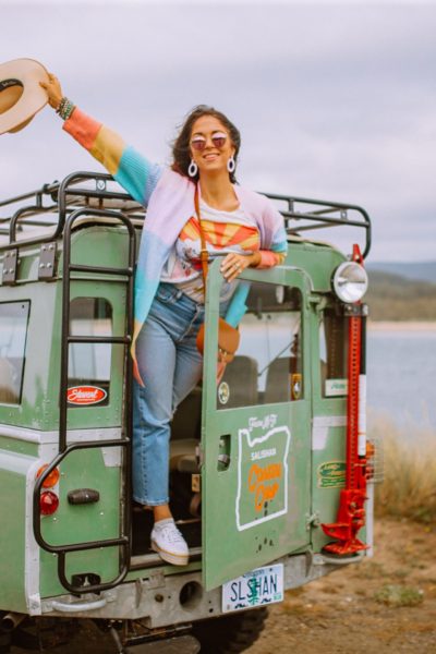 Girl on a 1960's Land Rover on Oregon Coastline