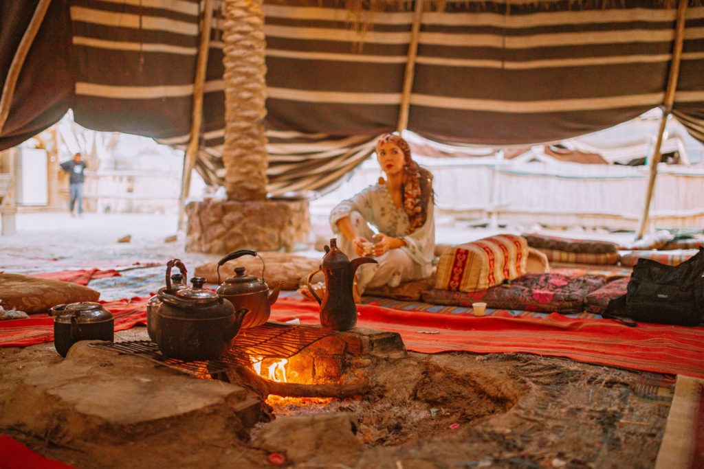 Girl sitting in a bedouin tent at Kfar Hanokdim in Israel