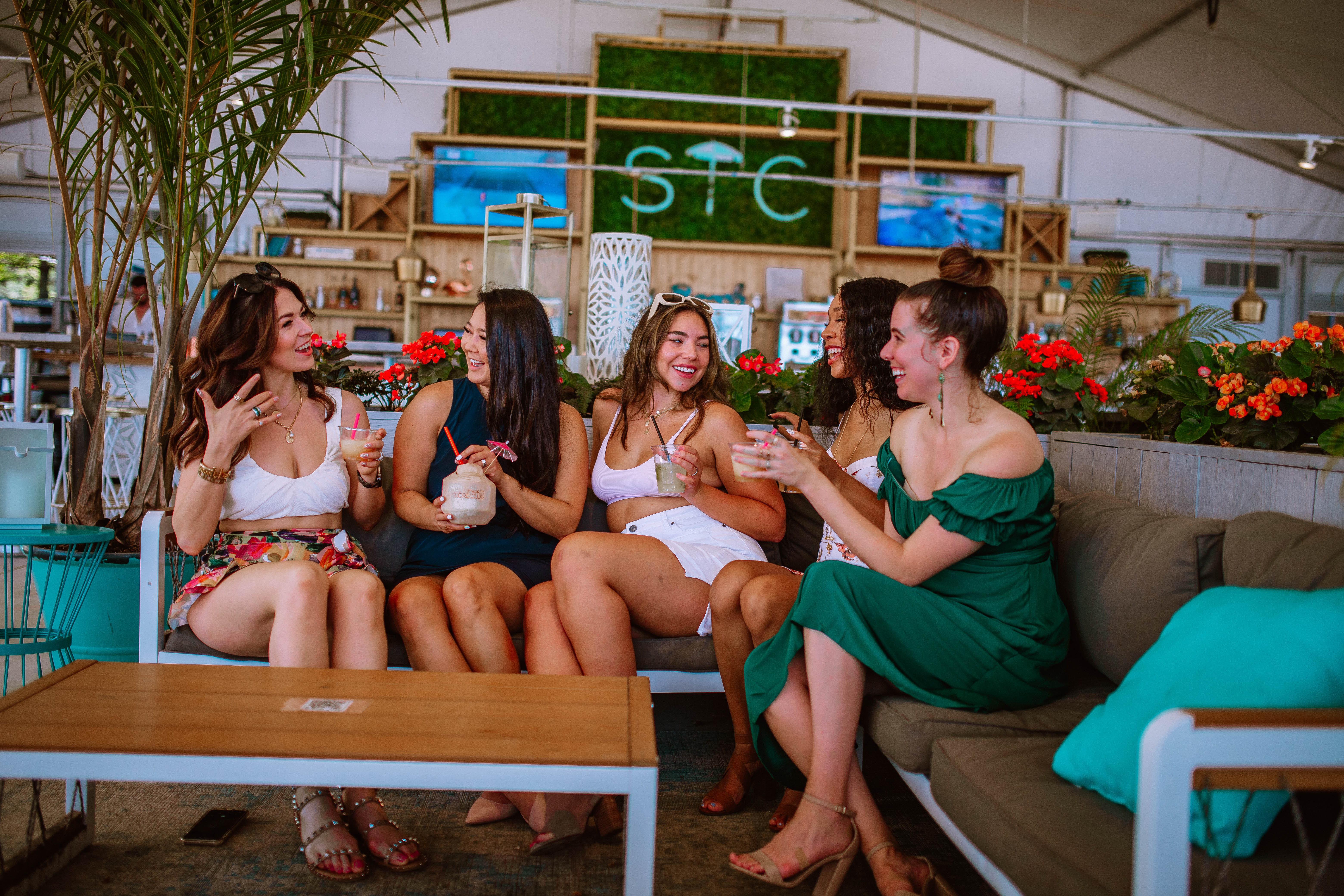 Girlfriends enjoying cocktails at the Shoe Club Oasis Beach Club in Chicago