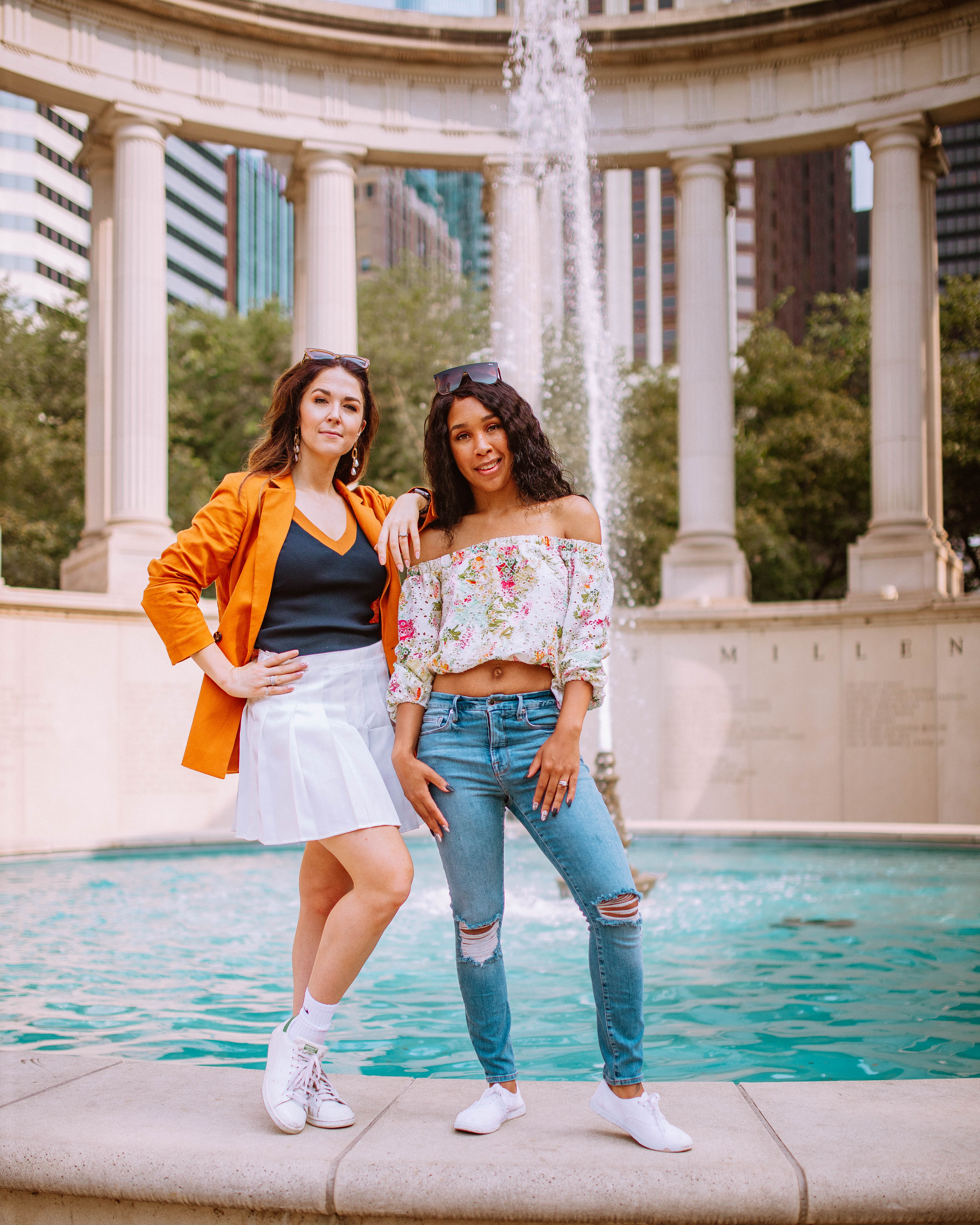 Two girls posed in front of the Millennium Monument