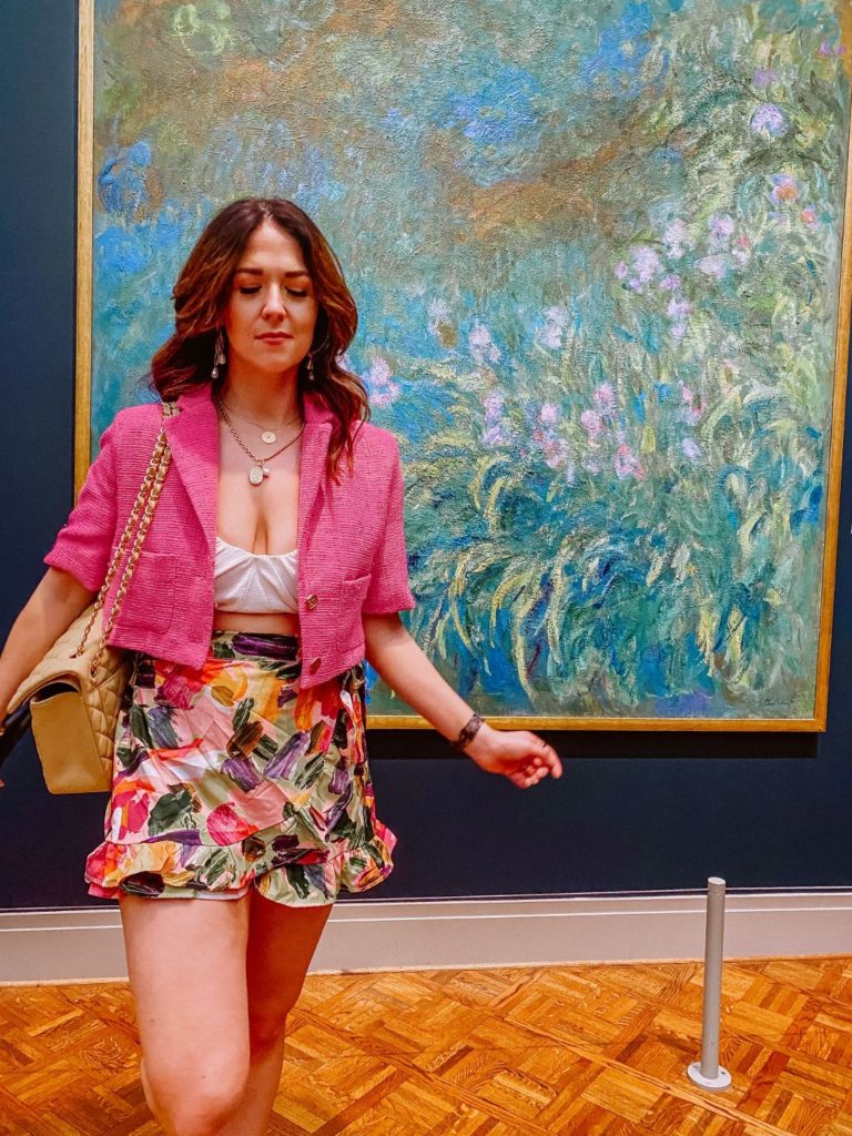 Girl stands in front of Monet's Water Lilies Painting at the Chicago Art Institute 