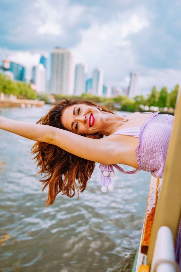 girl hanging over the boat on the Chicago river boat tour